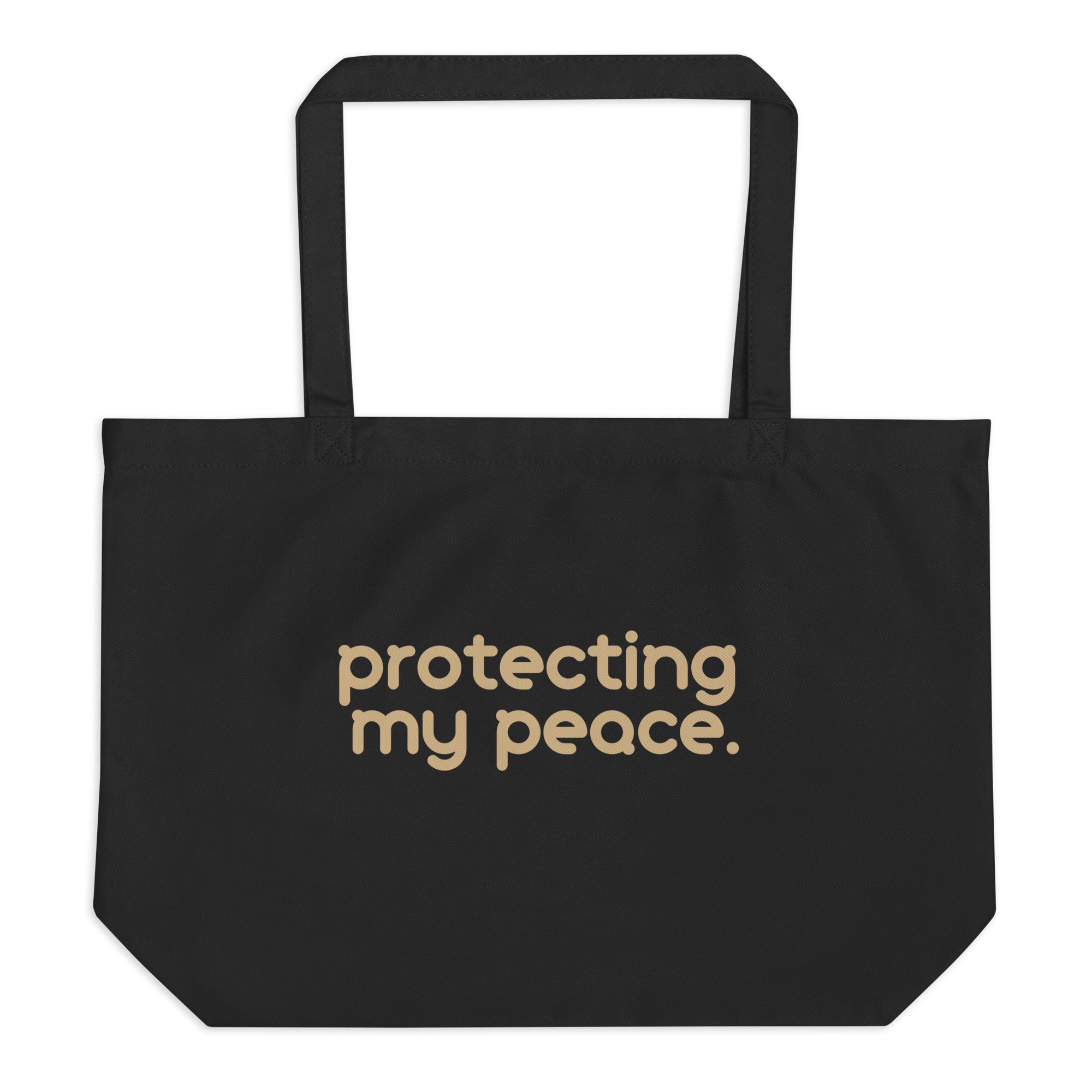 Protecting My Peace Tote Bag in black with bold beige lettering, made from organic cotton for a stylish and empowering everyday look.