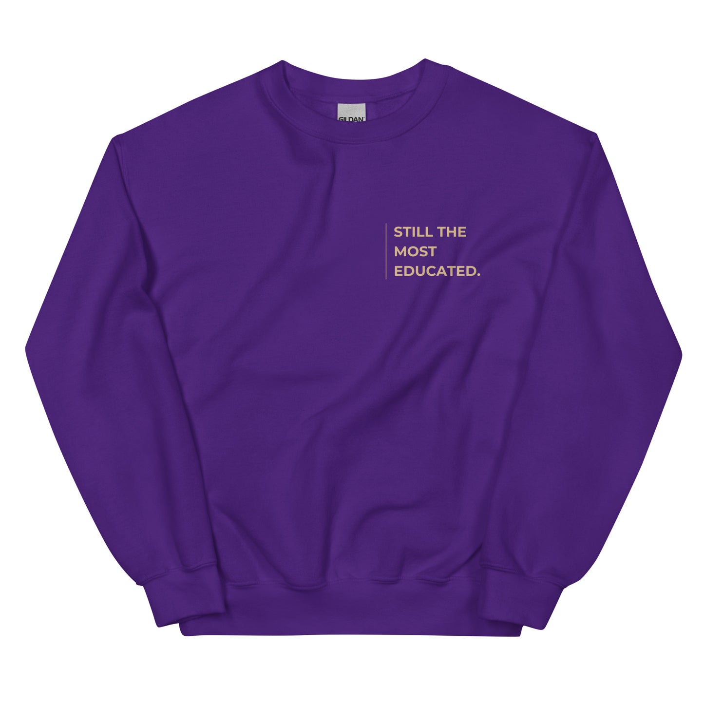 Still the Most Educated Sweatshirt in deep purple with beige lettering, a bold and stylish statement piece for those embracing education and wisdom.