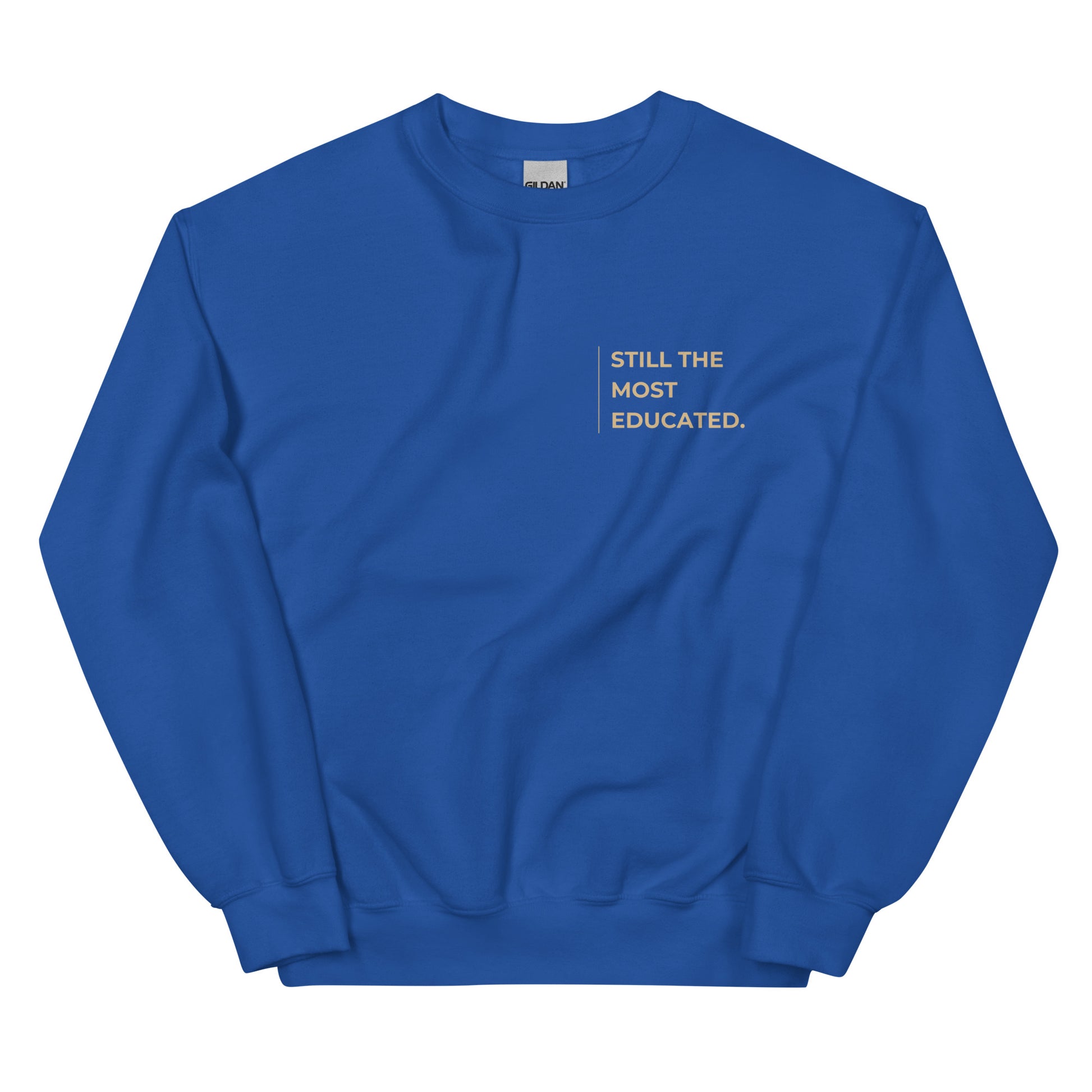 Still the Most Educated Sweatshirt in royal blue with beige lettering, a fashionable and empowering pullover for graduates, scholars, and professionals